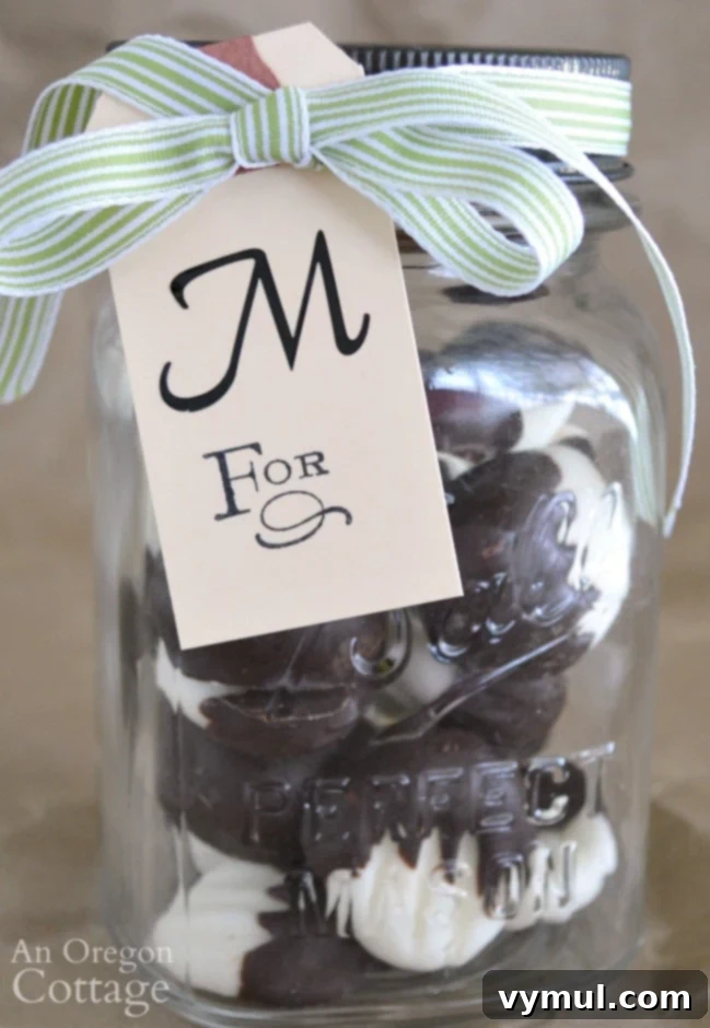 Beautifully presented dark chocolate cream cheese mints in a vintage mason jar, tied with a decorative ribbon, making a charming homemade gift for any occasion.