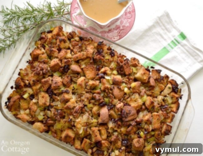 Savory & Sweet Sausage Cranberry Stuffing Dressing served in a baking dish.
