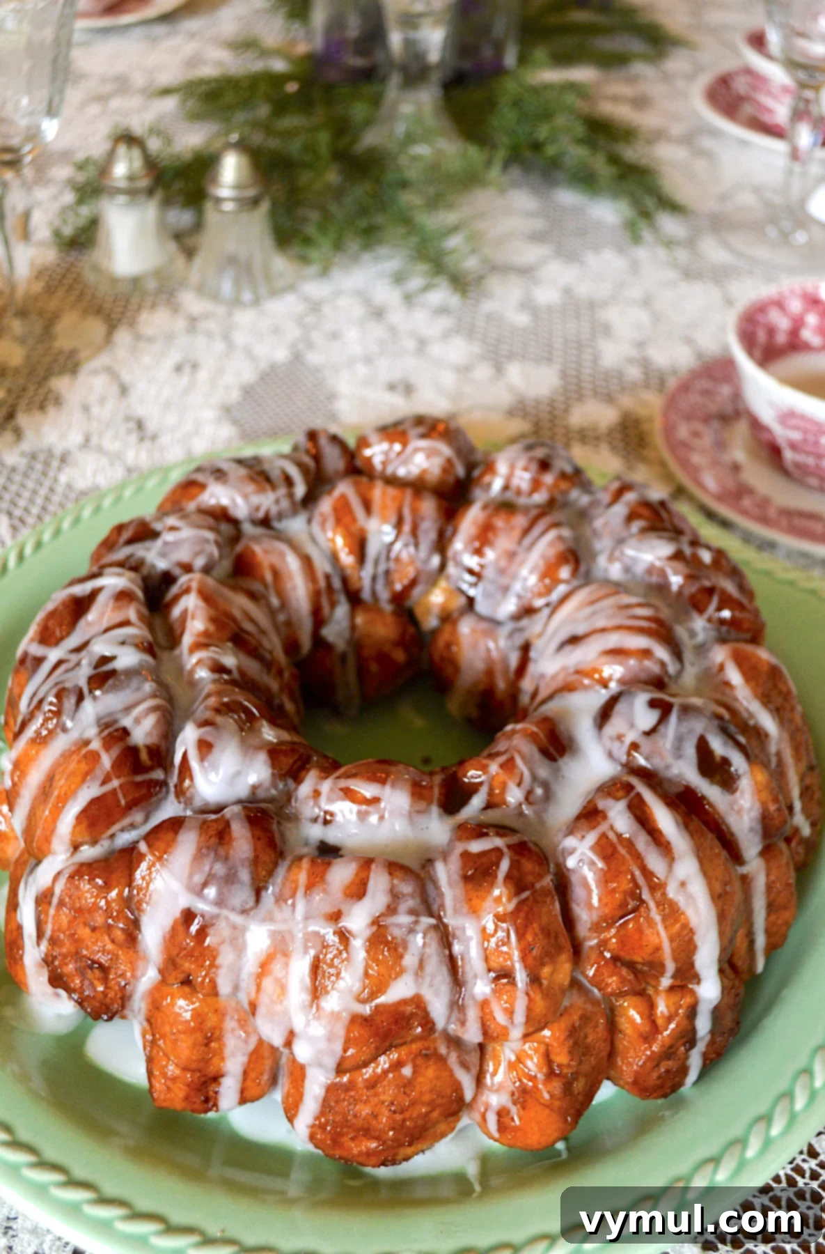 glazed loaf of monkey bread on Christmas table, with festive decorations