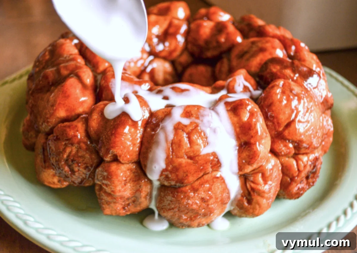 adding glaze to baked monkey bread, still in the bundt pan