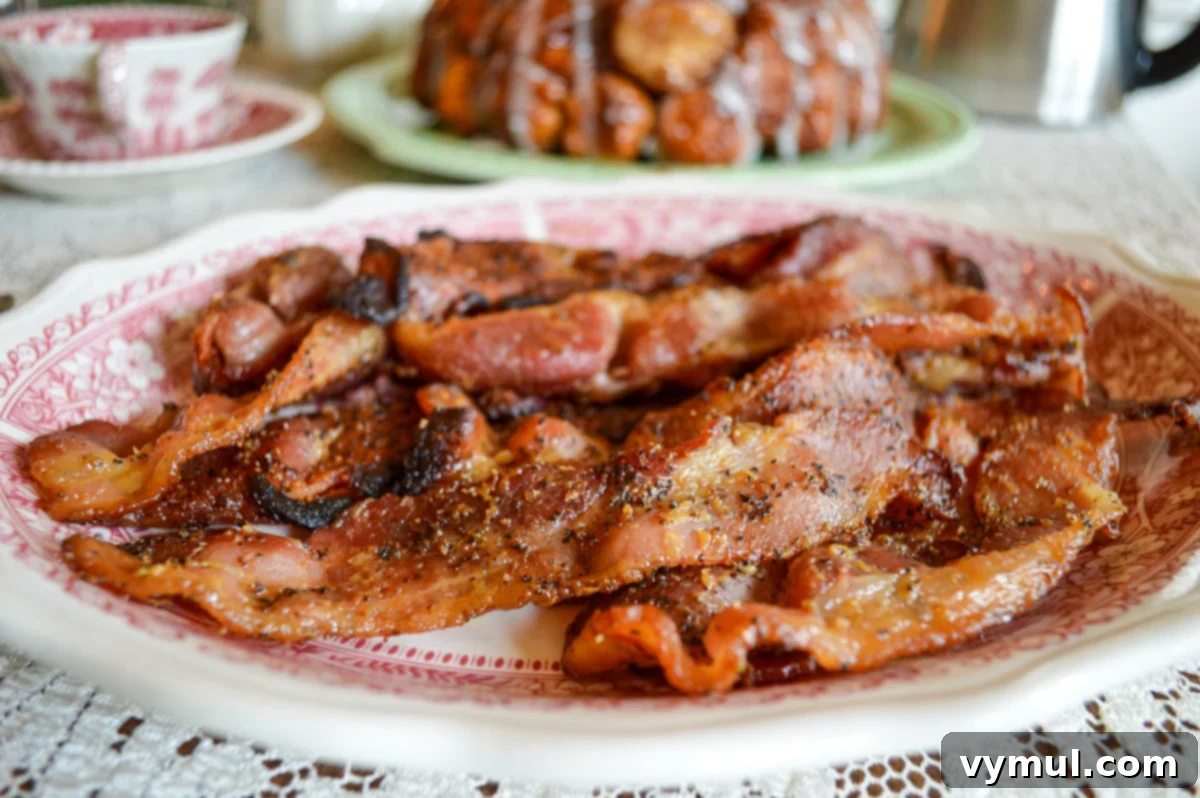 cooked coated bacon on plate on a table