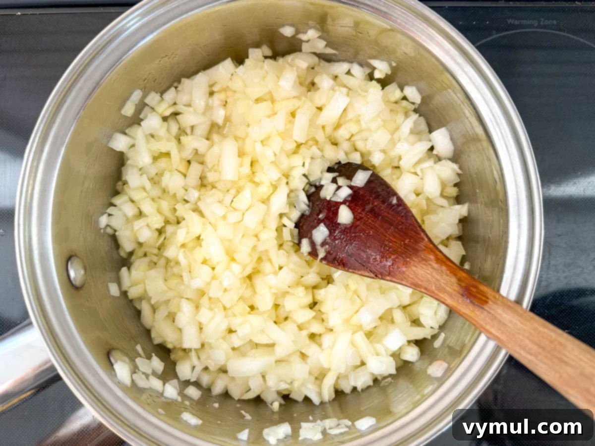 Simple Homemade Pizza Sauce for Canning Fresh or Frozen Tomatoes 7 sauteing onions in saucepan