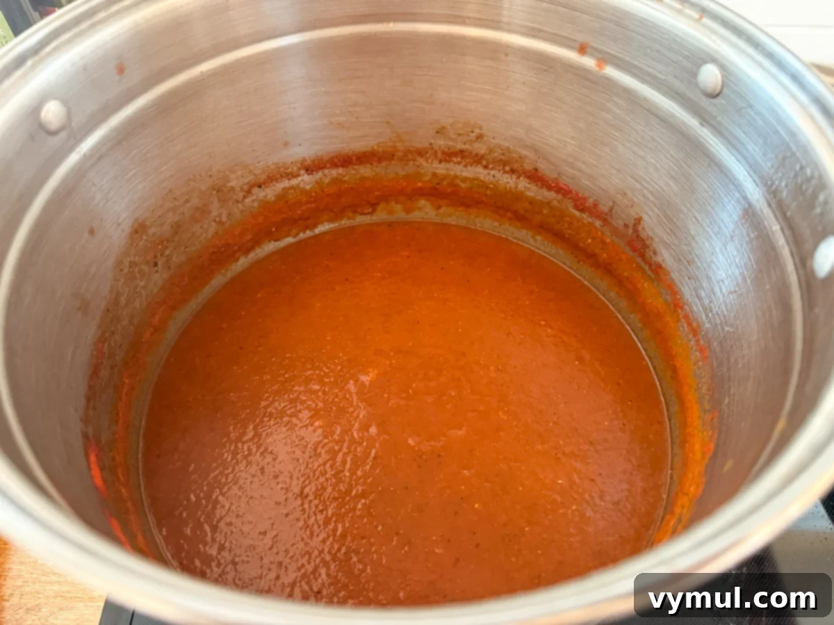 Simple Homemade Pizza Sauce for Canning Fresh or Frozen Tomatoes 10 pizza sauce in stockpot after cooking down