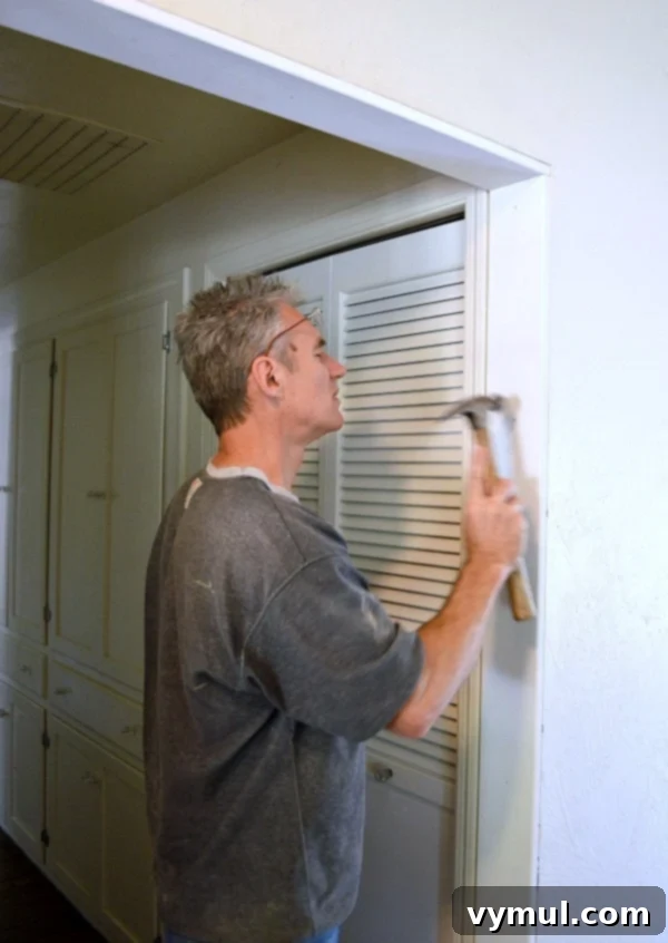 Instant Old-World Charm: Easy DIY Door Trim 4 Adding Character to a Doorway with Molding - Step 1: Install Top Piece - An Oregon Cottage
