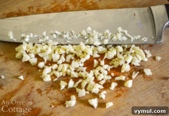 Bacon Lentil Curry with Golden Cabbage 4 Freshly chopped garlic ready for sautéing, a key aromatic in this curried lentil recipe.