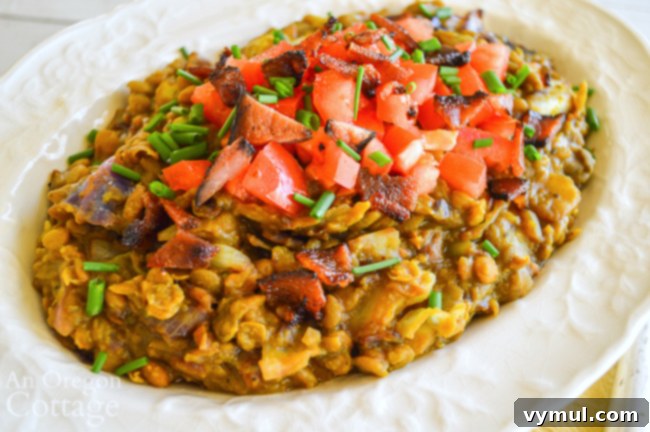 Bacon Lentil Curry with Golden Cabbage 7 A beautiful close-up of curried lentils in a bowl, showcasing the rich texture and vibrant colors of the dish, ready for serving.