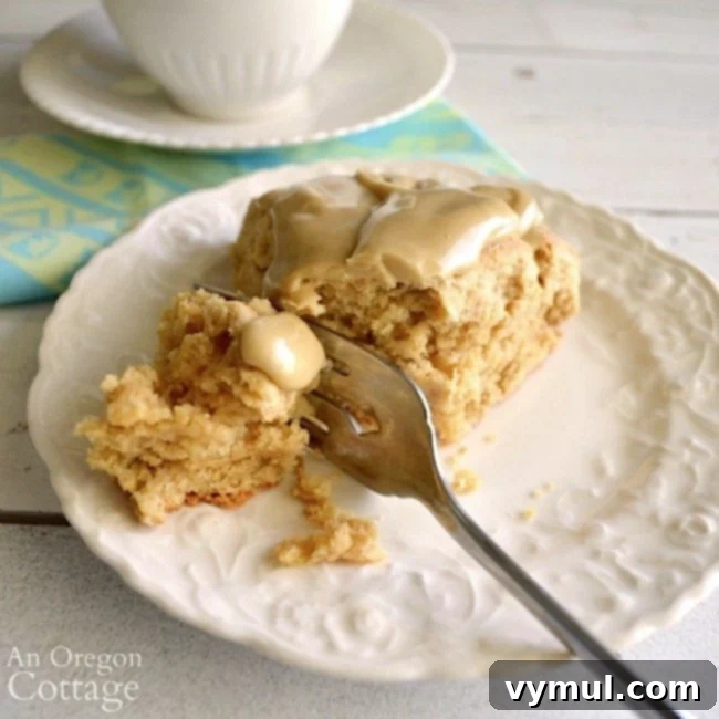 Close-up of a Maple Oat Scone on a plate with a fork, ready to eat