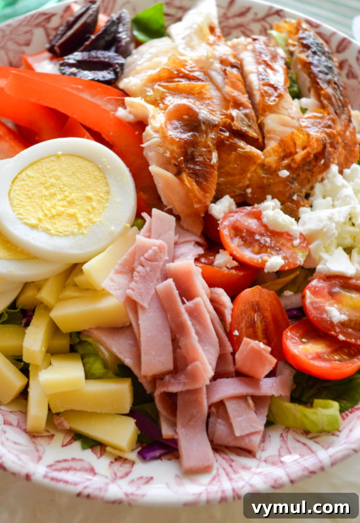 Simple Speedy Chefs Salad 4 Various ingredient sections arranged on a bed of lettuce for chef's salads, ready for individual customization and serving.