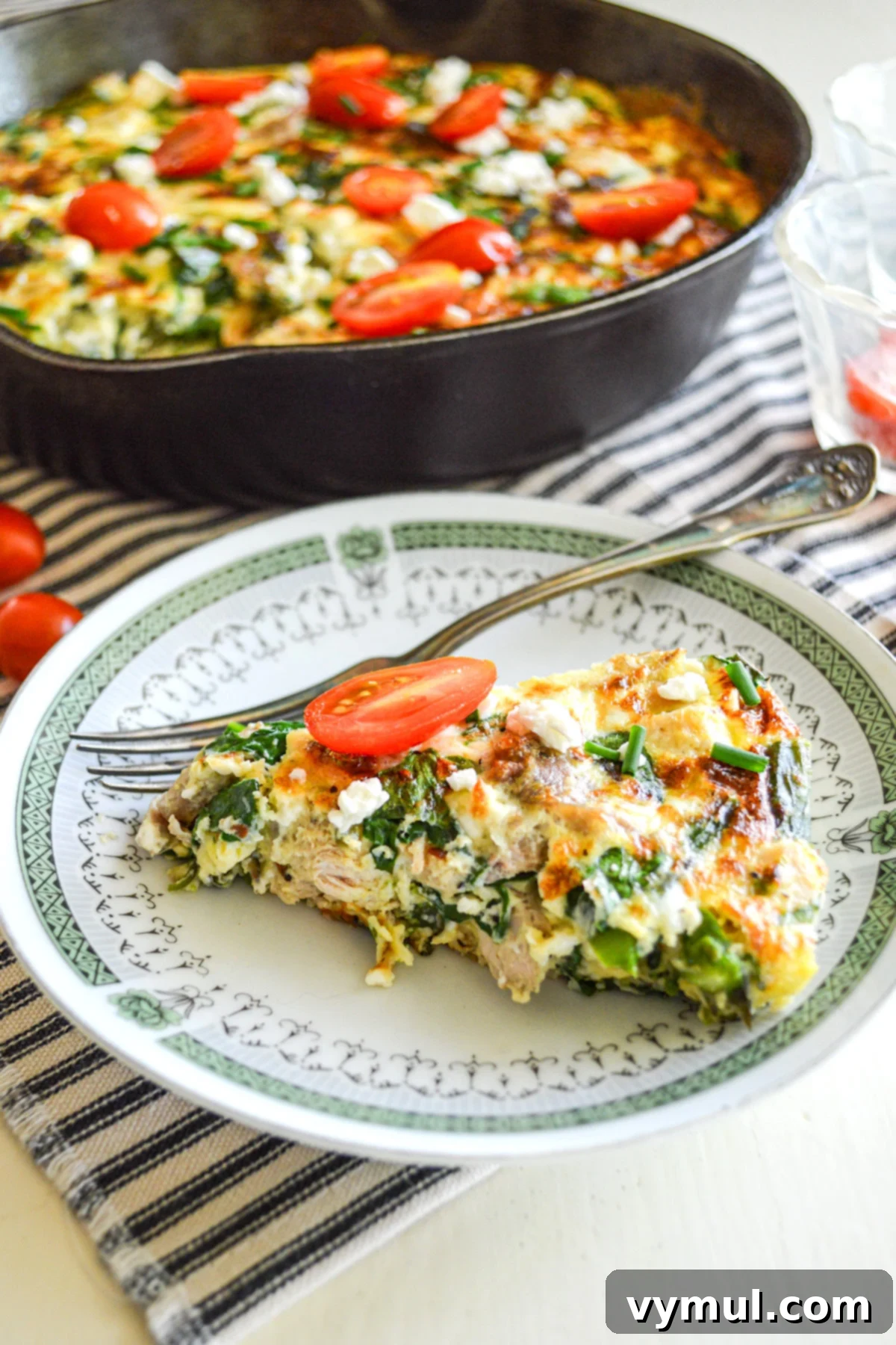 piece of frittata on green rimmed plate