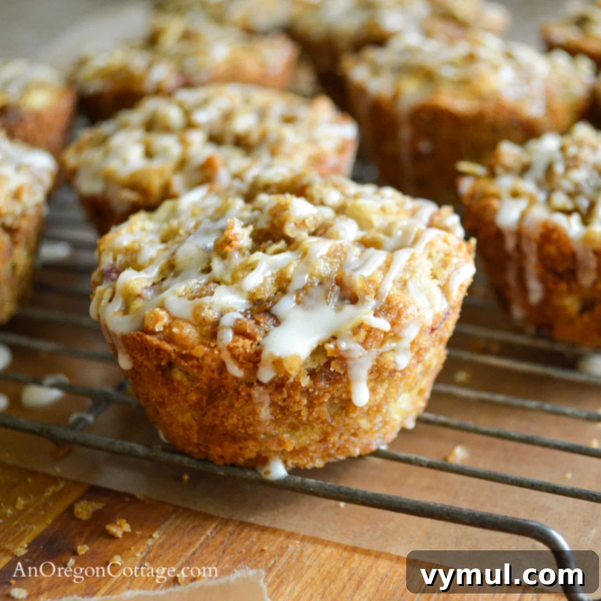 Easy Glazed Rhubarb Muffins 4 Freshly baked glazed rhubarb muffins cooling on a rack