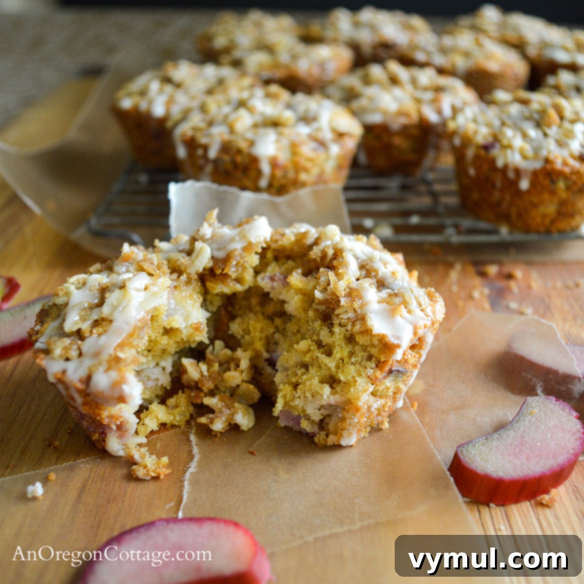 Easy Glazed Rhubarb Muffins 5 Cross-section of a rhubarb muffin showing moist interior