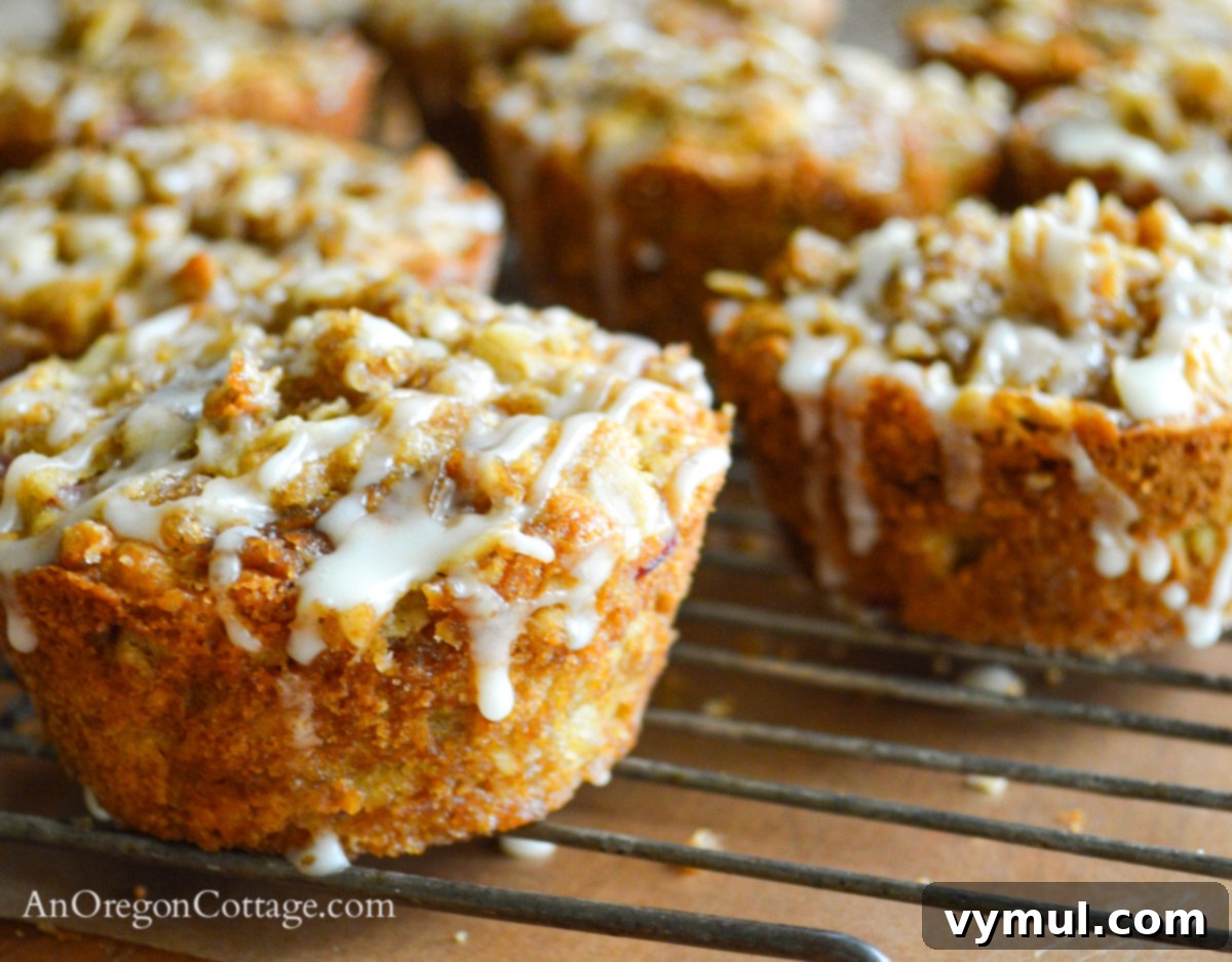 Easy Glazed Rhubarb Muffins 6 Close-up of glazed rhubarb muffins on a cooling rack