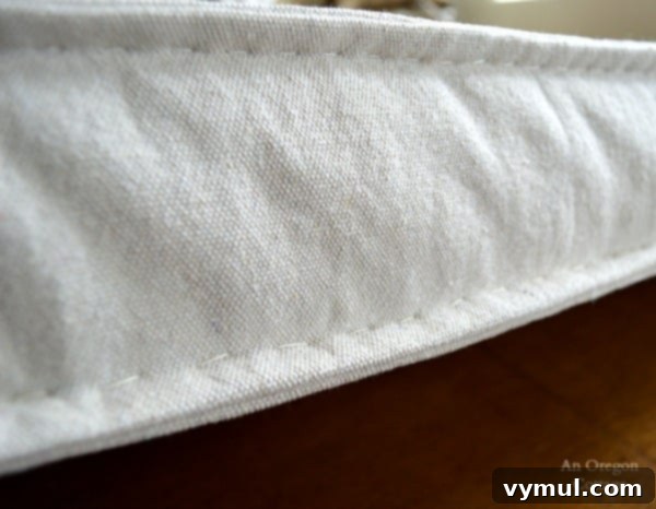 DIY Ballard Style Tufted French Mattress Cushion 8 French Mattress Cushion Tutorial-Imperfect Hand Sewn Edge - An Oregon Cottage