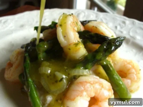 Mastering Asparagus: From Planting to Plate and Beyond 6 Shrimp and Asparagus over White Bean Puree, a delicious asparagus recipe.