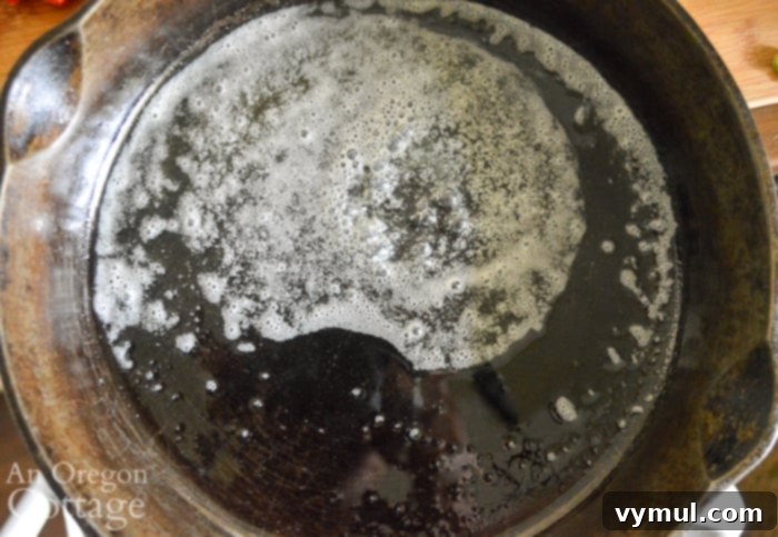 Melted butter in a skillet, ready for vegetables to be added.