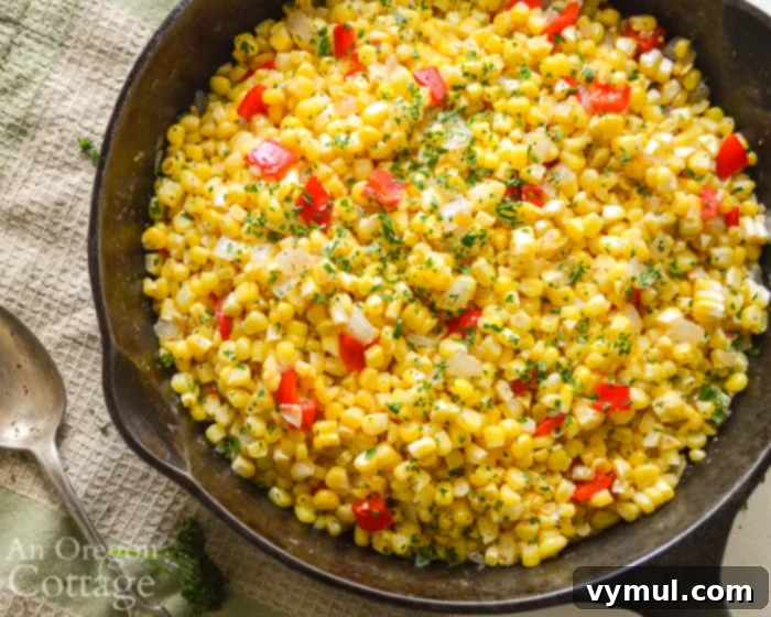 A skillet filled with a colorful corn, pepper, and onion sauté, ready to serve.