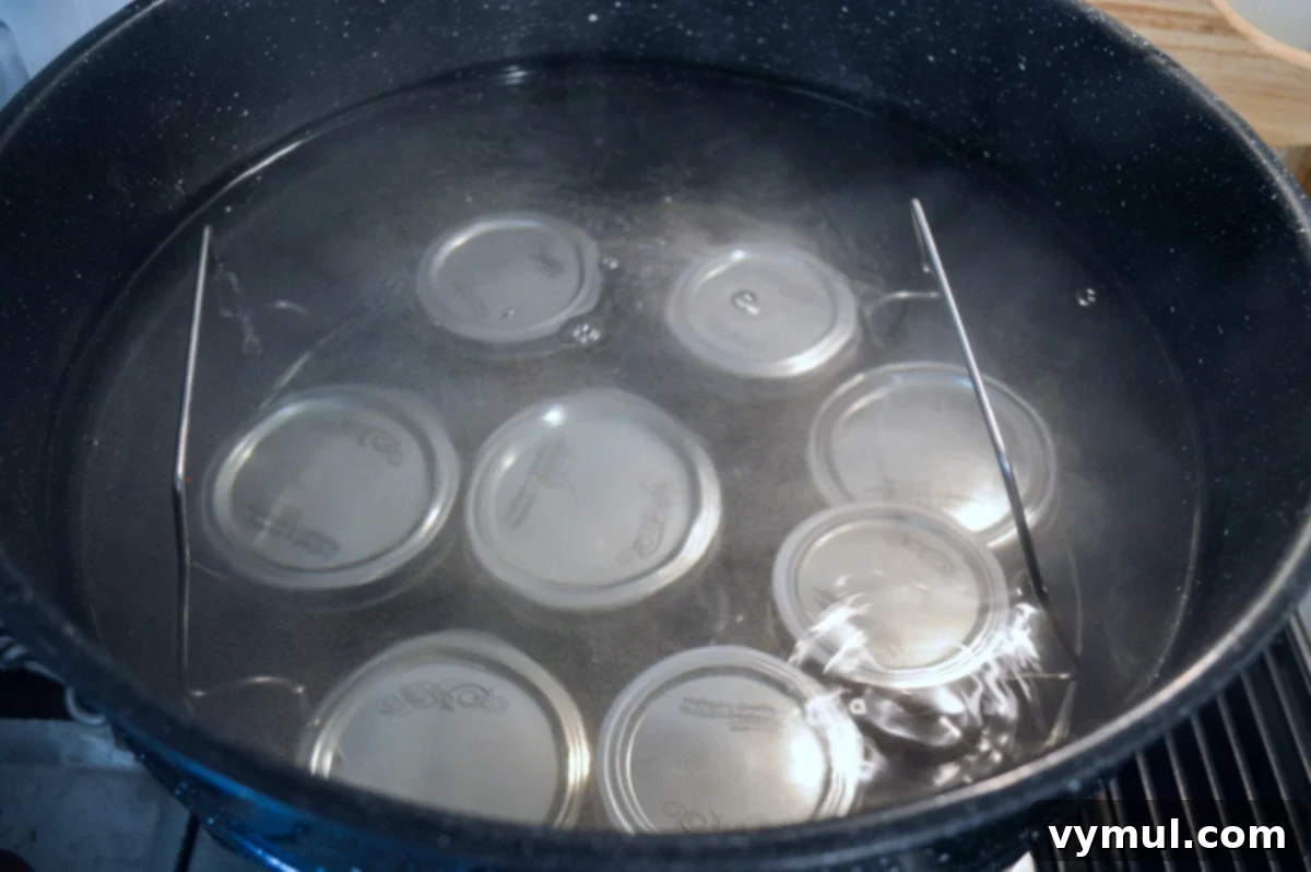 jars of jalapeno jelly in water bath canner