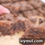 Irresistible Grain-Free Peanut Butter Honey Brownies 6 Grain-Free Peanut Butter Brownie with a bite taken out, highlighting its delicious texture.