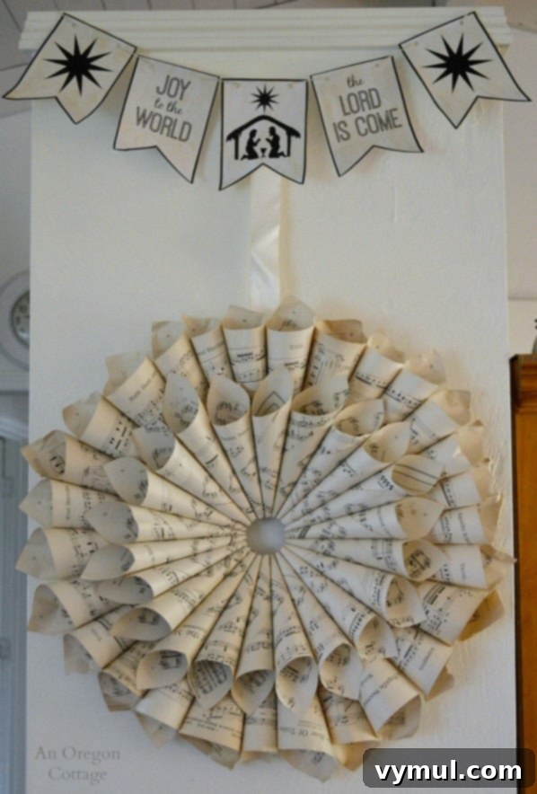 A Cozy Cottage Christmas 2014 9 Music sheet wreath and 'Joy to The World' banner on a cottage kitchen wall