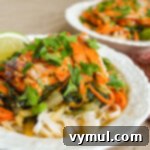 Easy One-Pan Sriracha Chicken Noodle Bowls 8 Sriracha Chicken Noodle Bowls with glazed chicken and fresh herbs