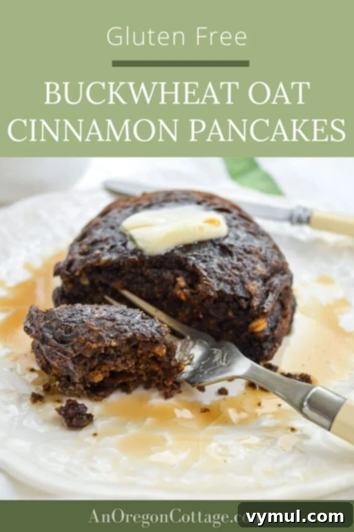 eating gluten free buckwheat oat cinnamon pancakes with berries and syrup