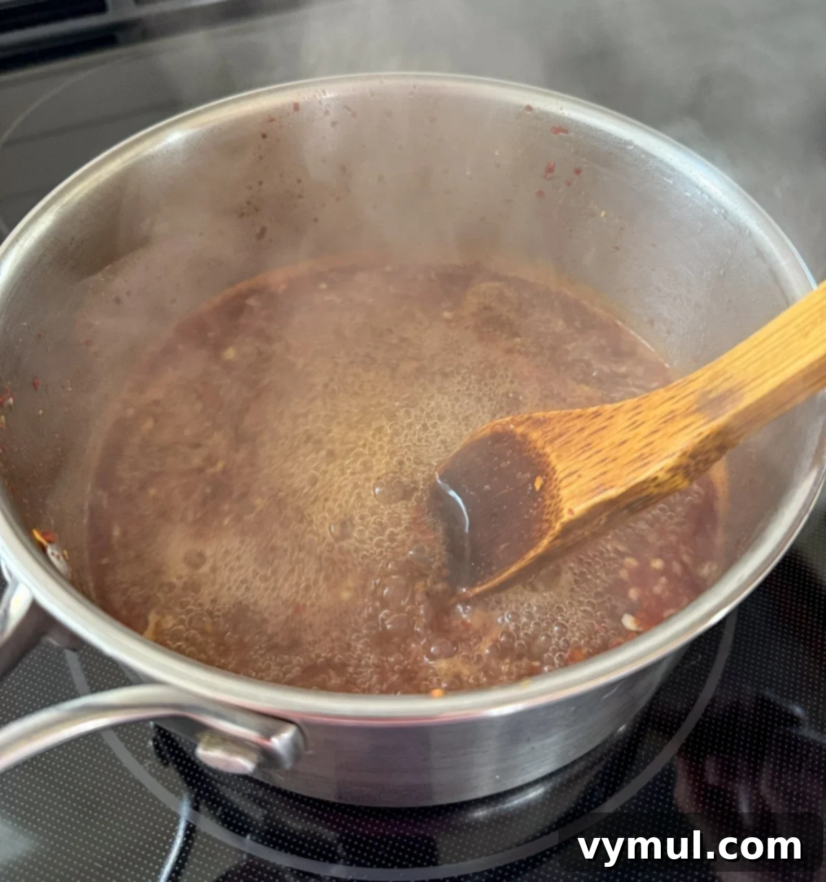 boiling sweet chili sauce in stainless pot