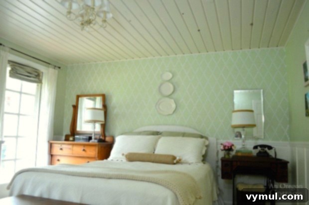 Bedroom accent wall featuring a beautiful trellis stencil design