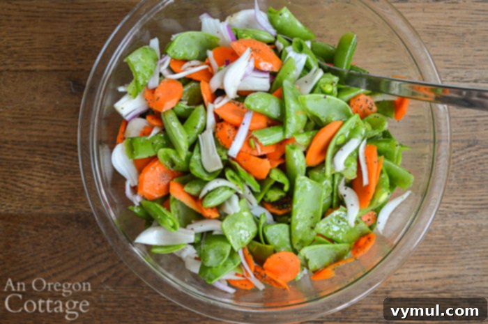 chopped vegetables ready for grill - including carrots, onions, and peas