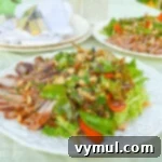 Thai Grilled Pork-Vegetable Salad with a rich, spicy peanut dressing