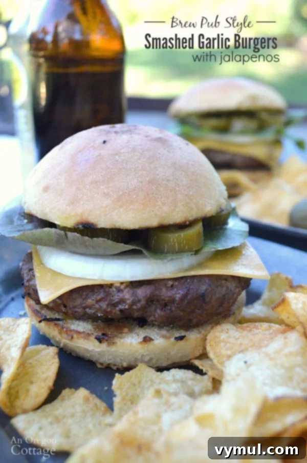 Smashed Garlic Jalapeno Burgers Brewpub Style 2 Brew pub style smashed garlic burgers with pickled jalapeños on toasted buns, served with chips