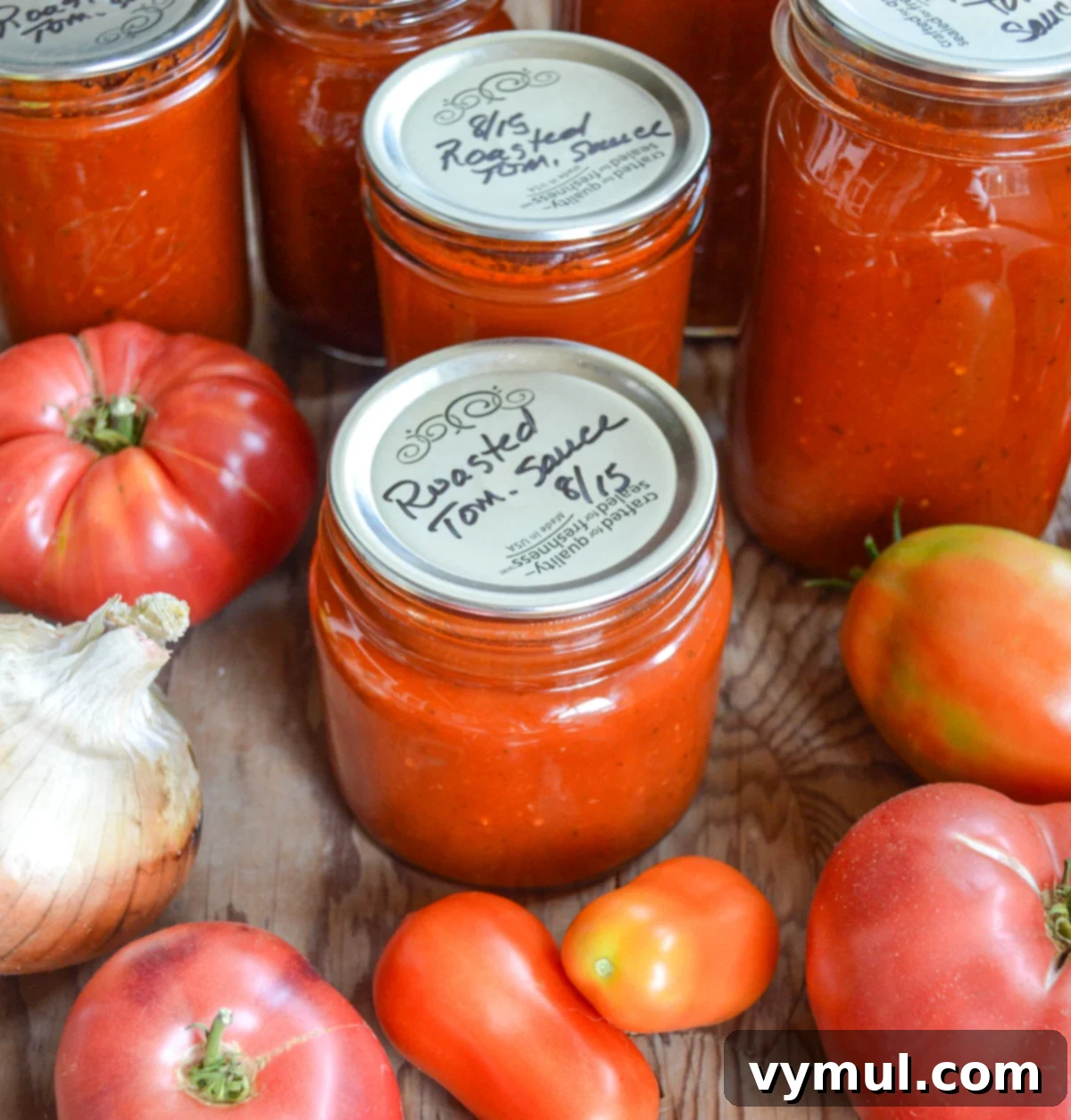 Home Canned Roasted Tomato Sauce 3 canned roasted tomato sauce jars with fresh tomatoes