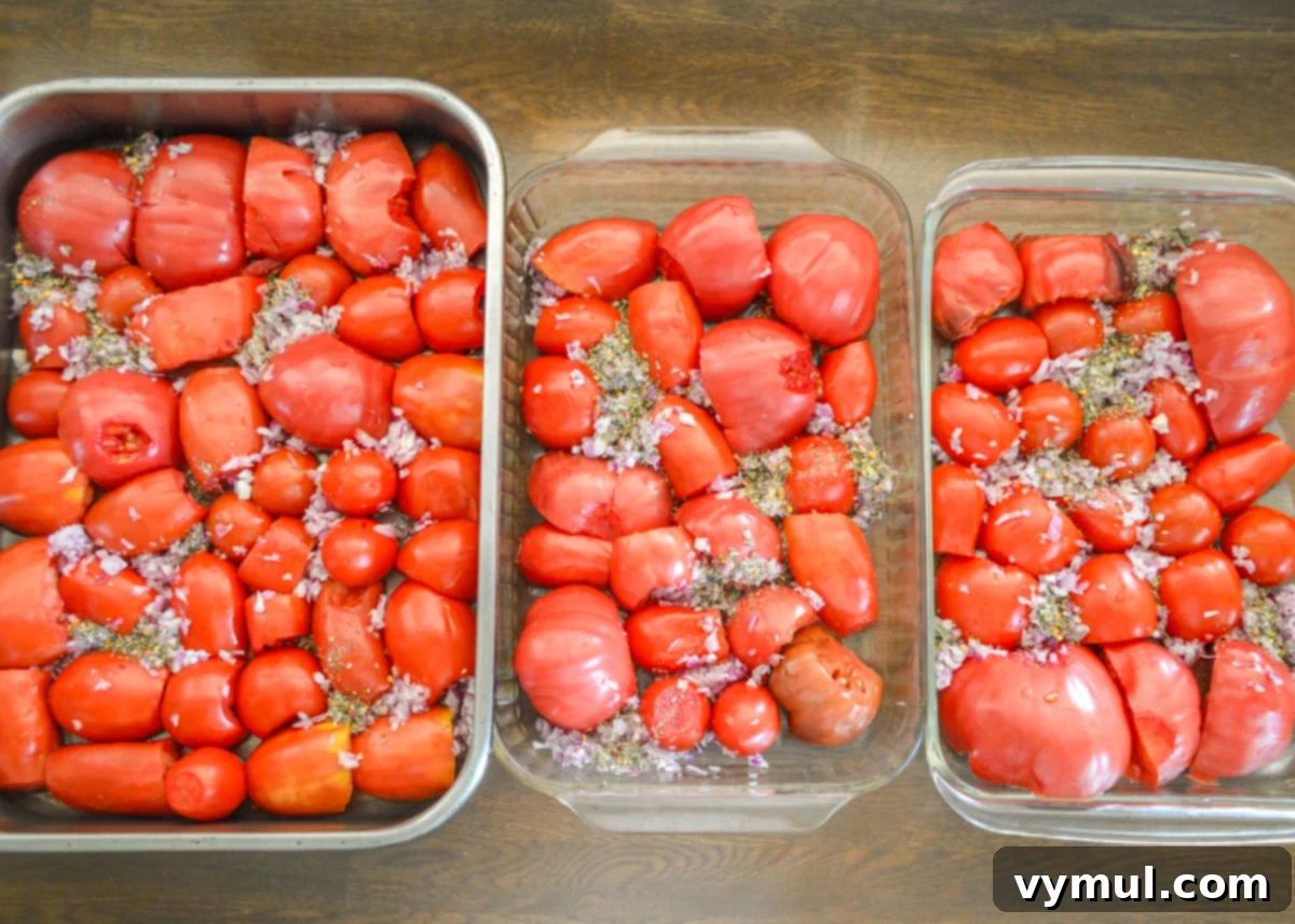 Home Canned Roasted Tomato Sauce 4 three baking pans of halved tomatoes and seasonings ready for the oven