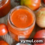 Home Canned Roasted Tomato Sauce 9 open jar of canned roasted tomato sauce close
