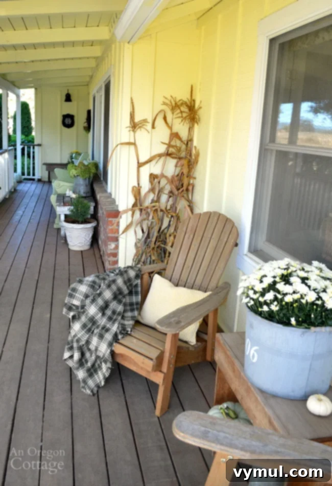 Easy Fall Porch Decorating using green, yellow, and white pumpkins, mums, and hydrangeas.