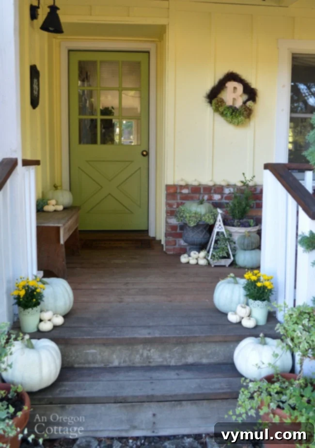 Neutral & Natural Fall Porch featuring green, white pumpkins, and hydrangeas for fall decor.