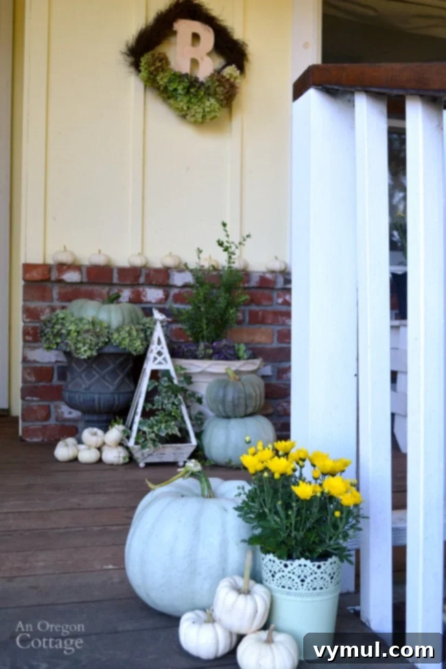 Fall Porch 2015 entry with neutral and natural fall decor, showcasing pumpkins and mums.