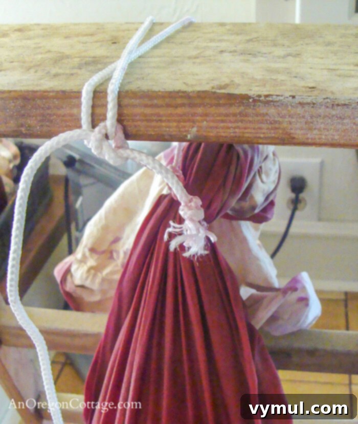 pillowcase tied to lumber hanging jelly bag