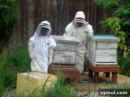 Z-K-with bees Zack, 'The Bee Man', with his adorable nephew fully suited up for a beehive inspection.
