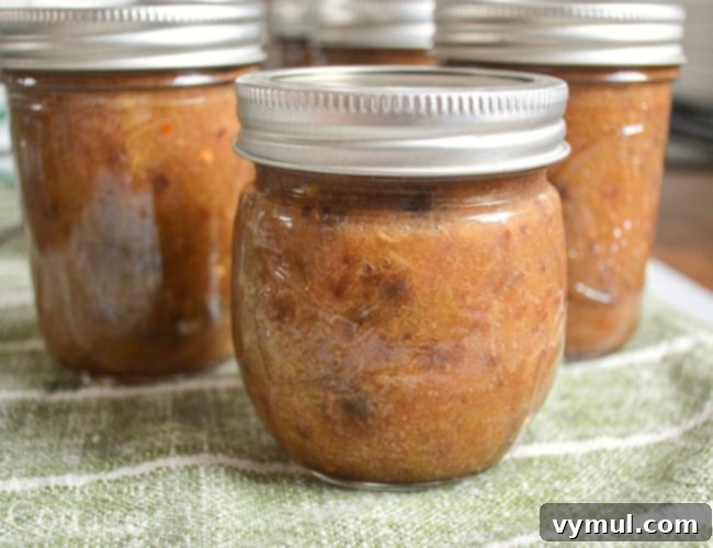 Spicy Rhubarb Chutney: Sweet Heat for Your Shelf 3 Spicy rhubarb chutney beautifully stored in glass jars, ready for canning or freezing.