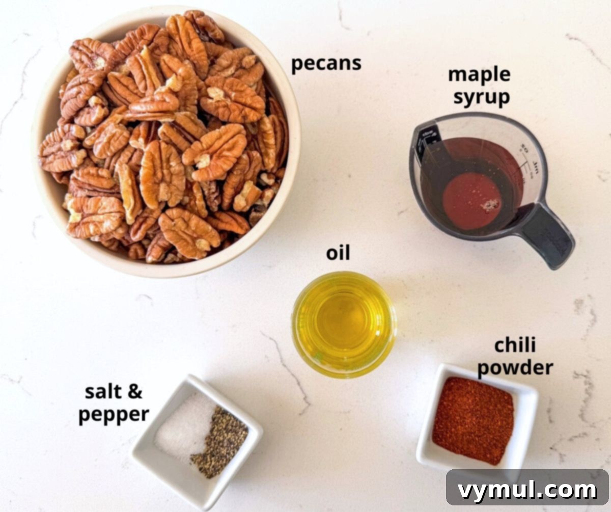 simple ingredients for maple candied pecans, including pecans, maple syrup, and olive oil