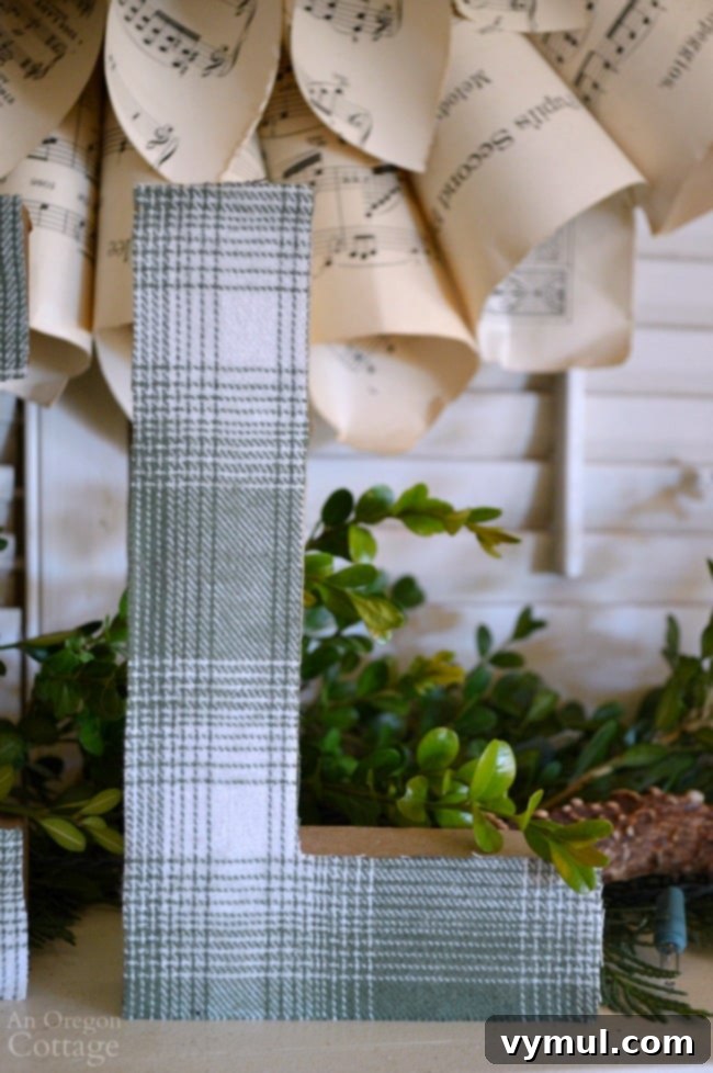 Plaid Fabric Wrapped Paper Mache Letters 6 Close-up of DIY Plaid Paper Mache Letter 'L' with raw edges