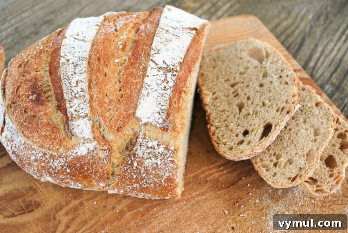 The One-Day Sourdough Secret: Artisan Bread Made Simple 15 sliced whole wheat sourdough artisan bread, showing a denser but still airy interior crumb