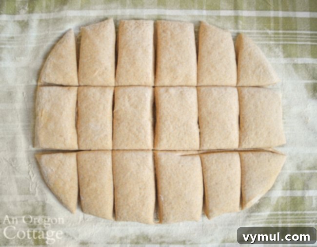 cutting sourdough bagel dough