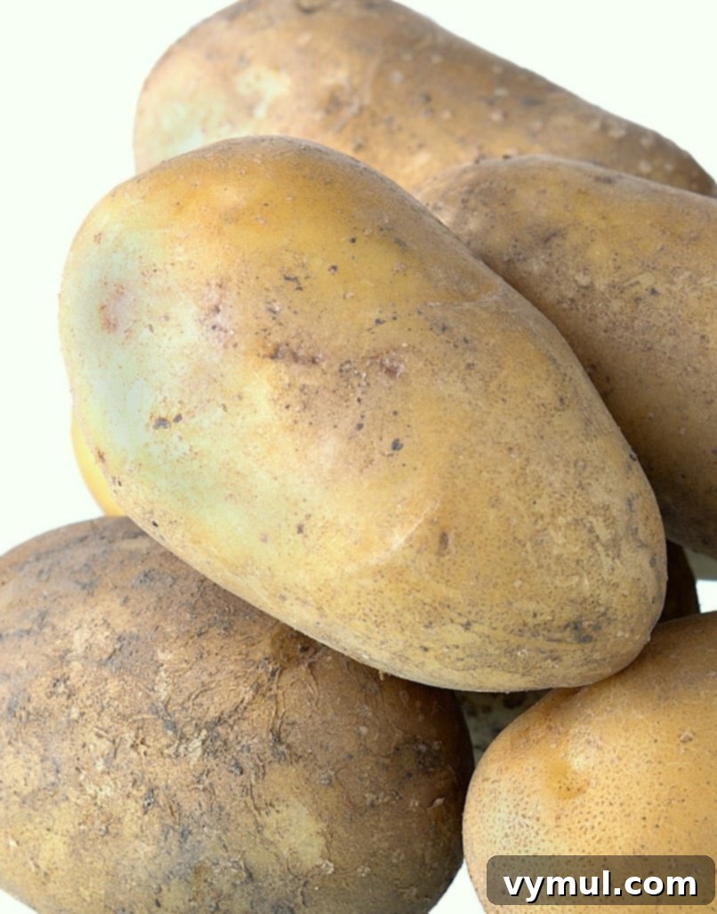 potatoes with green sections on the skins