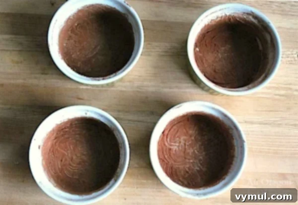 Easy Lava Cakes-dusting with cocoa powder