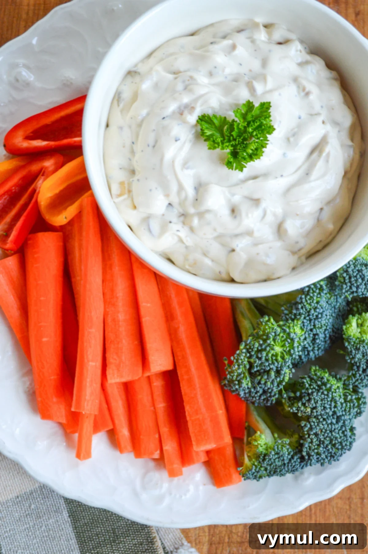 Best Ever Easy Homemade French Onion Dip 2 onion dip in white bowl with carrots and broccoli