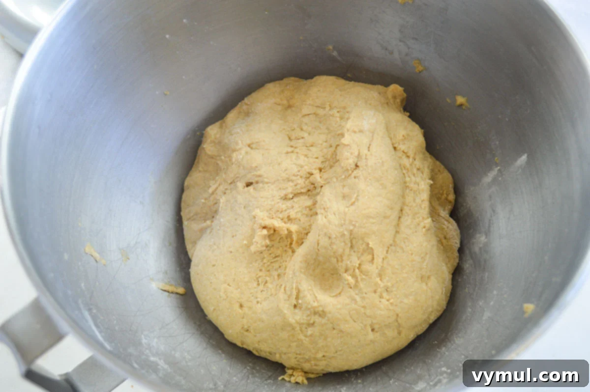 Easy 1-Hour Homemade Pigs In a Blanket 4 Smooth, soft homemade dough in a mixing bowl, ready for the next step of making pigs in a blanket.