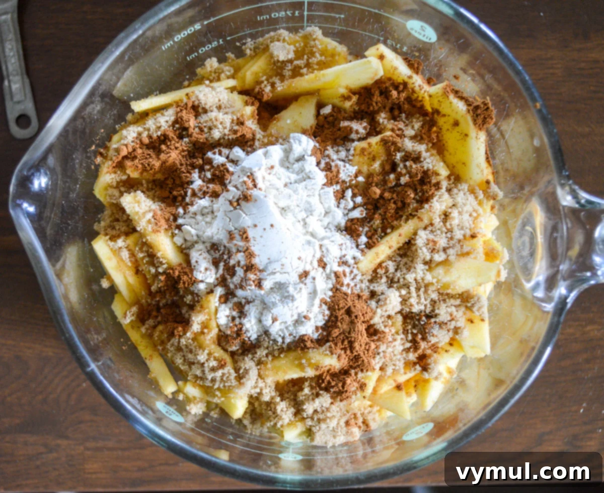sliced apples with filling ingredients in a bowl