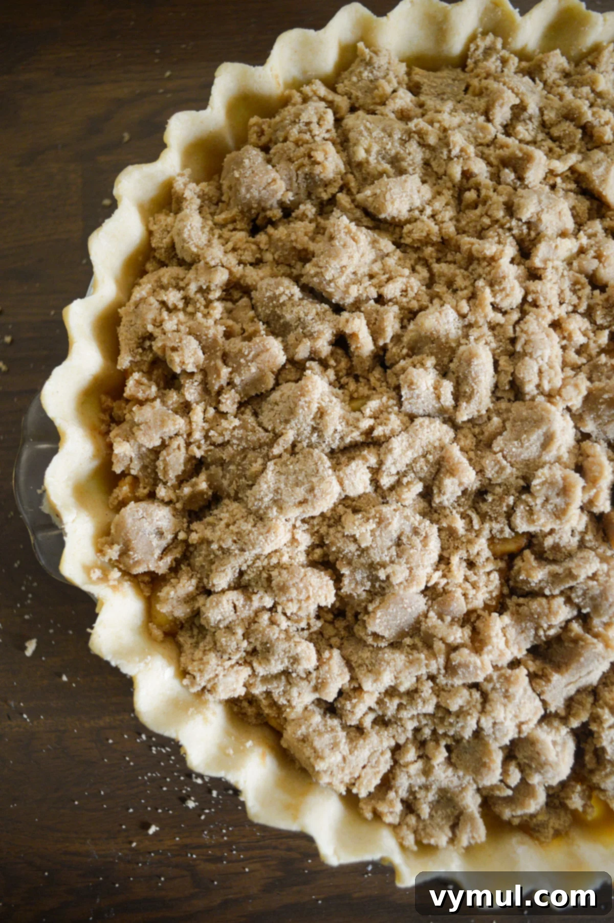 unbaked apple pie with crumb topping