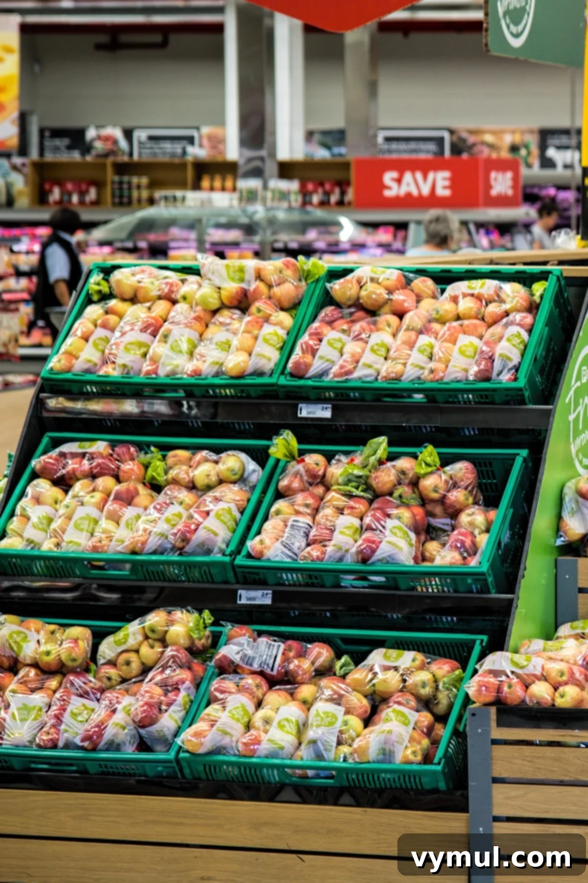 Grocery Savings Secrets Shop Wisely Spend Less 2 Fresh apples displayed in abundance at a vibrant grocery store, ready for healthy shopping.